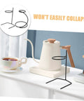Grab A Fresh Cup With This Premium Solid Metal Coffee Dripper Stand on a table beside a tea kettle and cup.