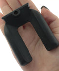Close-up of hand holding a rubber furniture caster foot pad from the 4 Pack Rubber Anti Slip Furniture Casters Foot Pads Prevent Sliding For Beds Sofas Desks And Chairs 2.68 By 2.24 Inch Bed Frame Stoppers And Fixers Durable Construction For Long Lasting Protection.