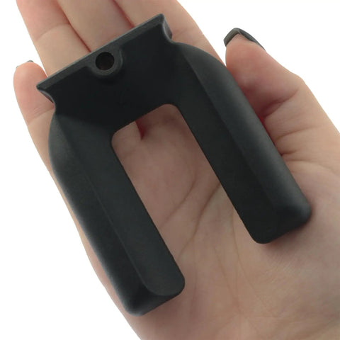 Close-up of hand holding a rubber furniture caster foot pad from the 4 Pack Rubber Anti Slip Furniture Casters Foot Pads Prevent Sliding For Beds Sofas Desks And Chairs 2.68 By 2.24 Inch Bed Frame Stoppers And Fixers Durable Construction For Long Lasting Protection.