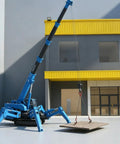 Built Different Heavy Duty Hydraulic Crawler Crane With Smooth Operator Folding Mechanism lifting a wooden panel outdoors.