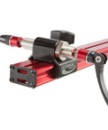 Close-up of Sprint Bike Repair Stand With Tripod Base And Dropout Style Mount Built To Last Compact Workstand in red aluminum.