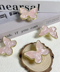 Pink Butterfly Shape Cabinet Knob Set Six Pack Handles for Cabinets, Drawers, Dressers, and Wardrobes on display