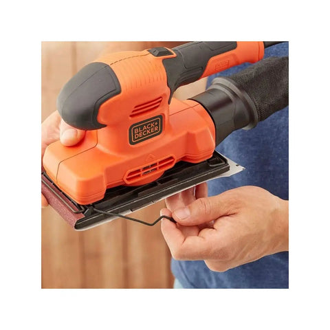 Heavy Workhorse Orbital Sander With One Third Sheet Pad And Quick Attach Clamps Cranks Out 14000 Rpm being used for sanding.