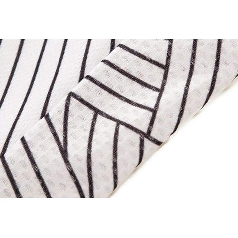 Close-up of fabric with black and white striped pattern, suitable for clothing or interior design.