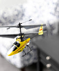 Yellow MCX Anniversary Edition RC Helicopter Ready To Fly Indoor Ultra Micro Flyer in living room, showing smooth stable flight.
