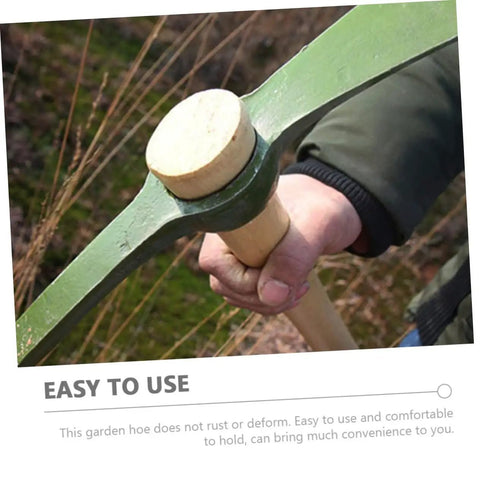 Person holding Steel Garden Pickaxe With Wooden Handle For Weeding And Soil Cultivation, Durable Hand Hoe