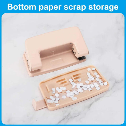 Beefy 6mm Two Hole Punch with paper scrap tray, ergonomic design for scrapbooking, DIY tags, and tickets in a pink finish.