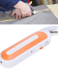 Cordless Electric Scissors For Cutting Fabric And Thick Leather Grab And Go Power Shears with orange handle cutting gray fabric.