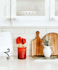 10 Pack Brushed Satin Nickel Knurled Cabinet Knobs installed on white kitchen cabinet doors above a countertop display