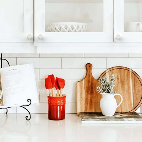 10 Pack Brushed Satin Nickel Knurled Cabinet Knobs installed on white kitchen cabinet doors above a countertop display