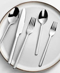 20 Piece Flatware Set For 4 In 18/10 Stainless Steel, Mirror Polished Silverware on white plate