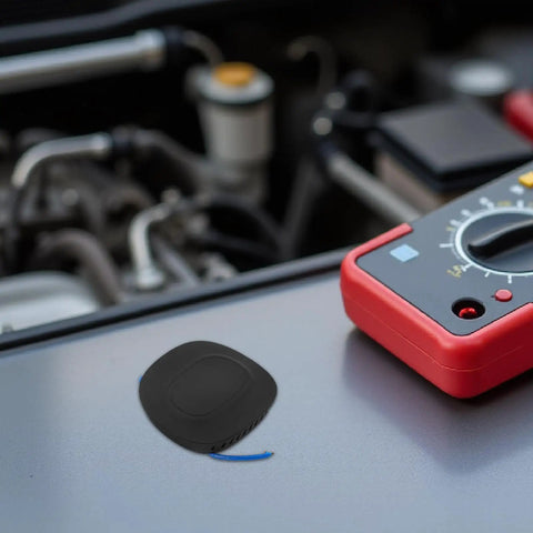 Automatic Vehicle Fire Extinguisher 30G Aerosol Suppression Kit for Cars Trucks ATVs RV placed on a vehicle engine.