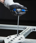 Eight-Piece T-Handle Hex Key Set With Six Inch Blades, Metric Allen Wrenches in use with metal frame, glove holding wrench