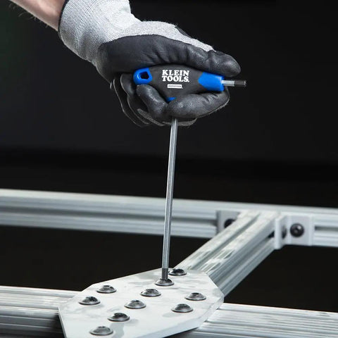 Eight-Piece T-Handle Hex Key Set With Six Inch Blades, Metric Allen Wrenches in use with metal frame, glove holding wrench