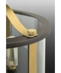 Close-up of Three-Light Bronze Outdoor Semi-Flush Convertible Fixture With Squire Style showing brass elements and glass detail.