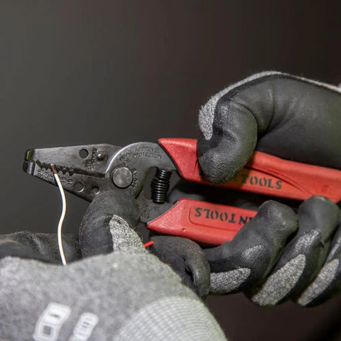 Gloved hands using Made In USA Compact Wire Stripper And Cutter For 16 To 26 AWG Stranded Wire With Narrow Nose Self Opening Spring