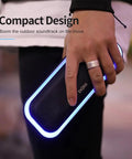 Person holding a 20W Bluetooth Speaker With Deep Bass And Stereo Sound 20 Hour Playtime IPX6 Waterproof Party Ready LED Lights