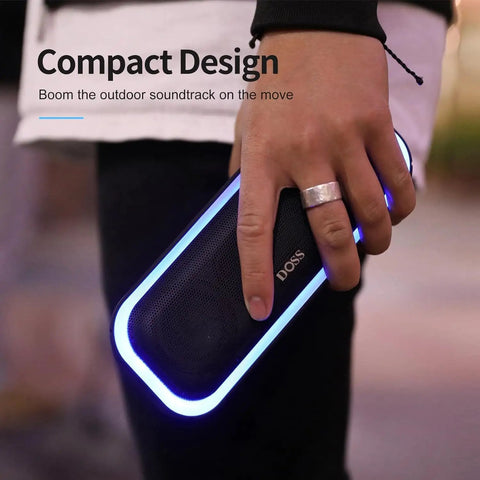 Person holding a 20W Bluetooth Speaker With Deep Bass And Stereo Sound 20 Hour Playtime IPX6 Waterproof Party Ready LED Lights