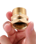 Close-up of the Two Pack Brass Garden Hose Adapter 3/4 GHT Female to 3/4 NPT Male Connector held by hand