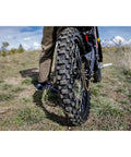 Rear Electric Dirt Bike Tire 80/90x19 Tube Type Fits Surron And Segway Talaria showing tread design and grip on uneven terrain.