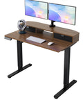 Spacious 40 X 24 Electric Standing Desk With Two Drawers And Hooks, Height Adjustable Computer Workstation C Clamp Mount Home Office Ergonomic Sit Stand Table Walnut with dual monitors.