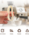 Hand holding a Two 54mm Silicone Steam Rings Replacement Gasket For 54mm Group Head Espresso Machines Easy Install Durable Food Grade Seals