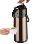 Upgraded Airpot Coffee Carafe With Double Pump Stainless Steel Drink Dispenser in use, serving hot beverage into cup