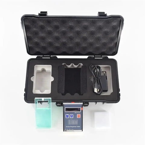 Open case containing Heavy Duty Digital Surface Roughness Tester, USB charger, and accessories for accurate Ra Rz measurements.