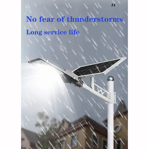 JUDYSSY Solar Street Lights Outdoor, waterproof solar flood light with solar panel under rain, designed for durability.
