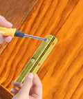 Pro Grade Mini Hinges 24 Pack Golden Finish 2 56 By 0 59 Inch Smooth Motion Hardware installed on wood with screwdriver.