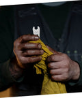 Hands holding an 8mm wrench and a yellow cloth featuring the Dead Accurate Open Head Torque Wrench For Road Bike Hydraulic Oil Disc Brake Systems.