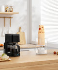 Two Tier Upright Cup And Condiment Organizer With Two Compartment Clear Acrylic Cup Dispenser in a breakroom coffee station