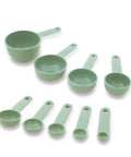 Nine Piece Measuring Cups And Spoons Set With Soft Grip Handle For Maximum Control Easy Read Measurements Nesting Design Hang Hole Dishwasher Safe Pistachio Everyday Kitchen Gear For Home Chefs arranged on a white background.