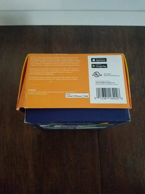 Back view of MyQ Smart Garage Hub WiFi Enabled Garage Controller box showing app store logos and barcode, old version black.