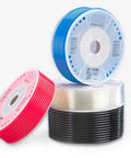 Three colorful rolls of polyurethane tubing, including red, blue, and black, showcasing flexibility for various applications.