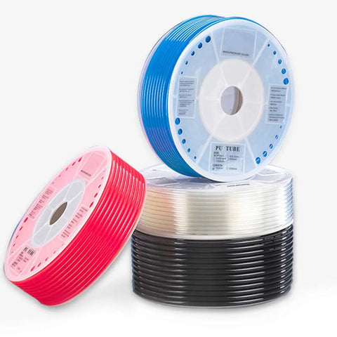 Three colorful rolls of polyurethane tubing, including red, blue, and black, showcasing flexibility for various applications.
