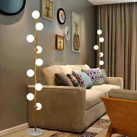 Cozy Elegant Mid Century Floor Lamp With Nine Lights For Living Room, Bedroom, And Office, Warm White 2700K Ambience next to a sofa