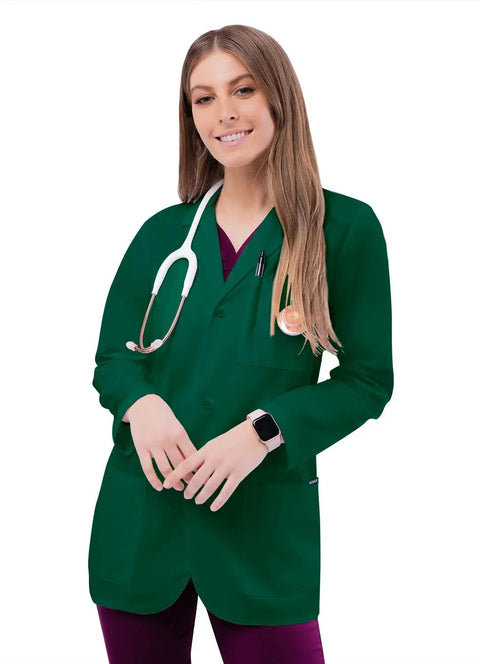 Pro Approved Unisex Lab Coat For Healthcare Crew Featuring Stacks Of Storage In Dual Patch Pockets And A Handy Chest Divider Classic Hunter Green Cut With A 31 Inch Back Hem Built Tough For Long Haul Clinic Days on a model with a stethoscope.