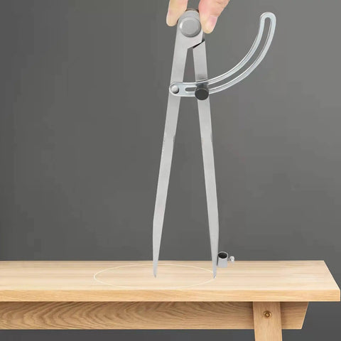 Tough As Nails All Metal Drafting Compass With Adjustable Wing Divider and Secure Pencil Holder in use, drawing circle on wood.