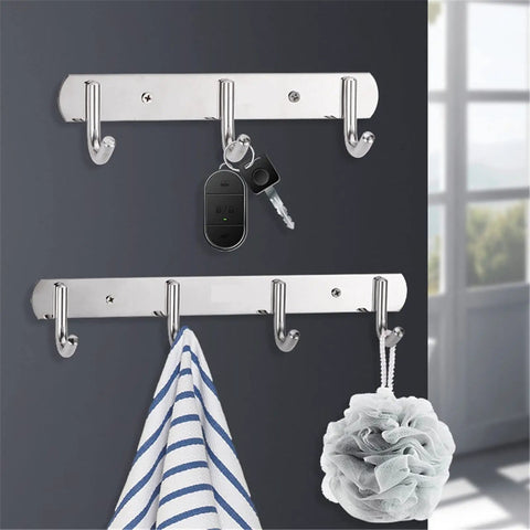 Total Game Changer Wall Mount Coat Rack Flip Down Swivel Hooks Sculptural Polypropylene Art For Bathroom Kitchen Durable Rock Solid Robe Hook Clothes Hat Bag Heavy Duty Organizer with keys and towel displayed.