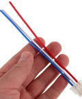 Hand holding a connector from the Universal Motorcycle Horn And Headlight Wiring Harness Connector Kit 4 Piece Set With Copper And Plastic Construction.