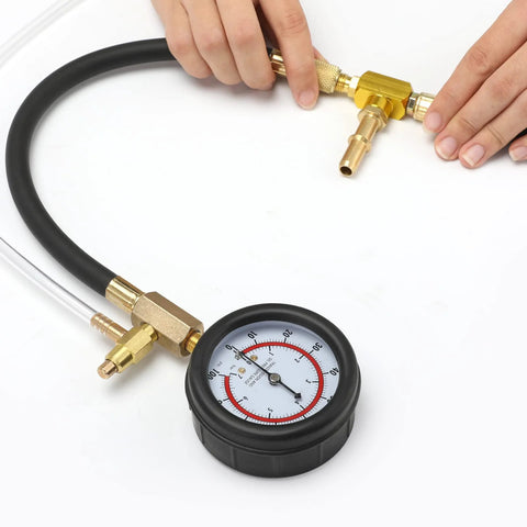 Fuel pressure test kit with brass fittings and 0-100 PSI gauge on a black hose.
