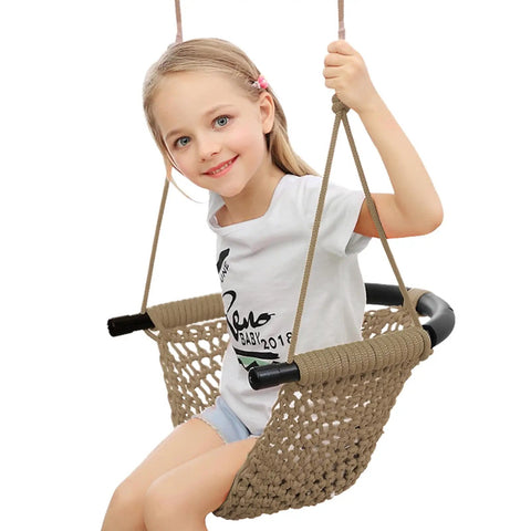 Child enjoying Hand Knitted Toddler Swing Seat With Adjustable Ropes, Outdoor Indoor Swing Set For Kids, Durable Polyester Rope, Light Brown.