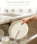 Hand placing Ceramic Portion Control Plate For Weight Loss With Three Compartments 9 Inch Divided Plate For Adults into dishwasher