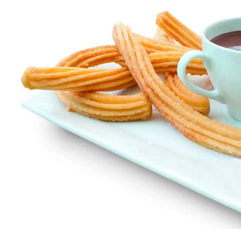 Pro Grade Stainless Steel Cookie Press Gun Kit With 10 Disc Variations And 8 Interchangeable Nozzles Dishwasher Safe 18/10 Inox Made In Spain Ideal For Piping Pretty Holiday Cookies And Desserts churros on plate