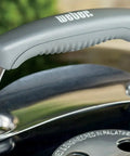 Lid handle detail of Original Kettle Charcoal Grill 22-Inch Black With One-Touch Cleaning System And Precise Temperature Control Dampers