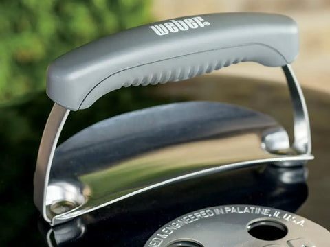Lid handle detail of Original Kettle Charcoal Grill 22-Inch Black With One-Touch Cleaning System And Precise Temperature Control Dampers