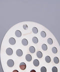 Close-up of 4 Inch Screw-In Shower Drain Cover Replacement Floor Strainer in Brushed Stainless Steel with circular holes