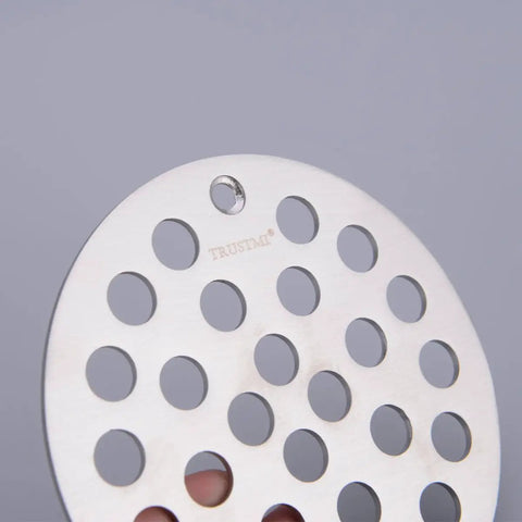 Close-up of 4 Inch Screw-In Shower Drain Cover Replacement Floor Strainer in Brushed Stainless Steel with circular holes