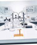 Inertia Demonstrator Hands On Pendulum Tool for Physics Classrooms on a lab table with flasks and equipment.